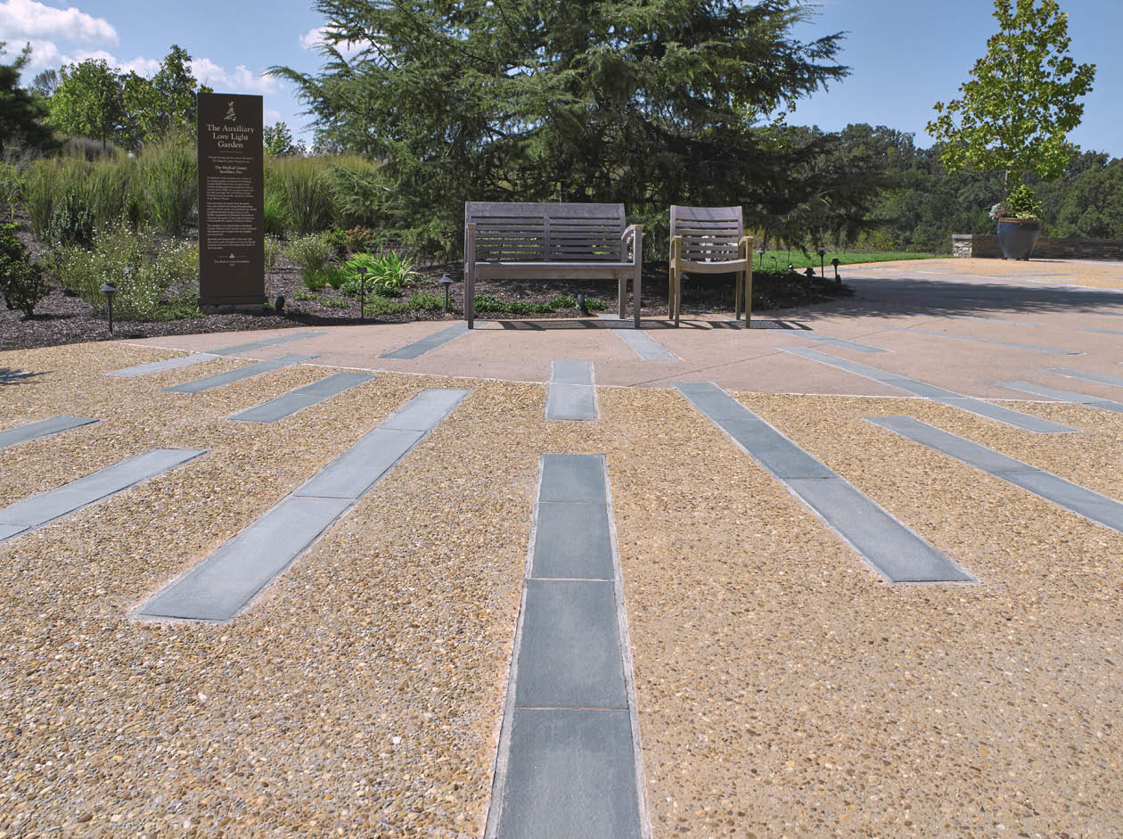 a custom formulation of Scofields Chromix Admixtures for Color-Conditioned Concrete. They also settled on a light acid-etched exposed aggregate finish with natural stone inlay accents.