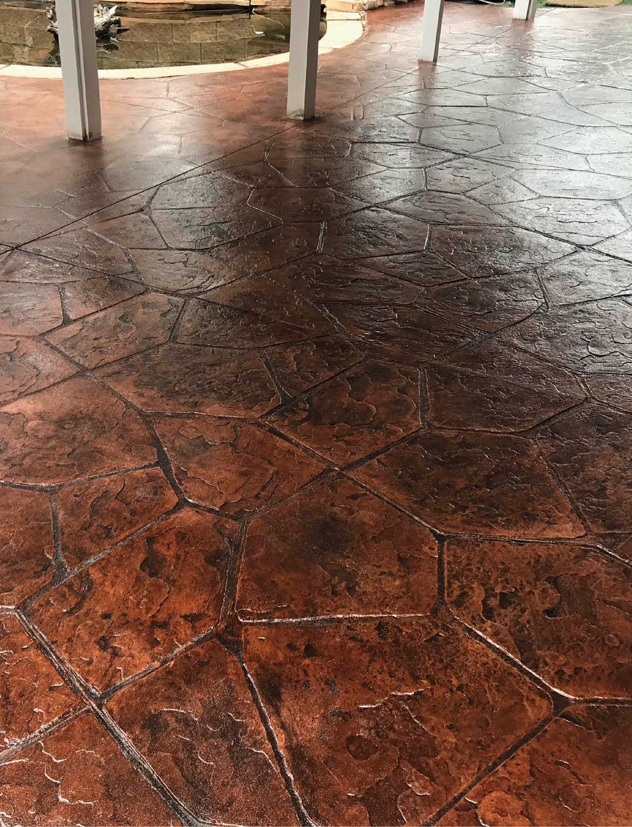 A concrete patio that has been sealed with a glossy concrete sealer