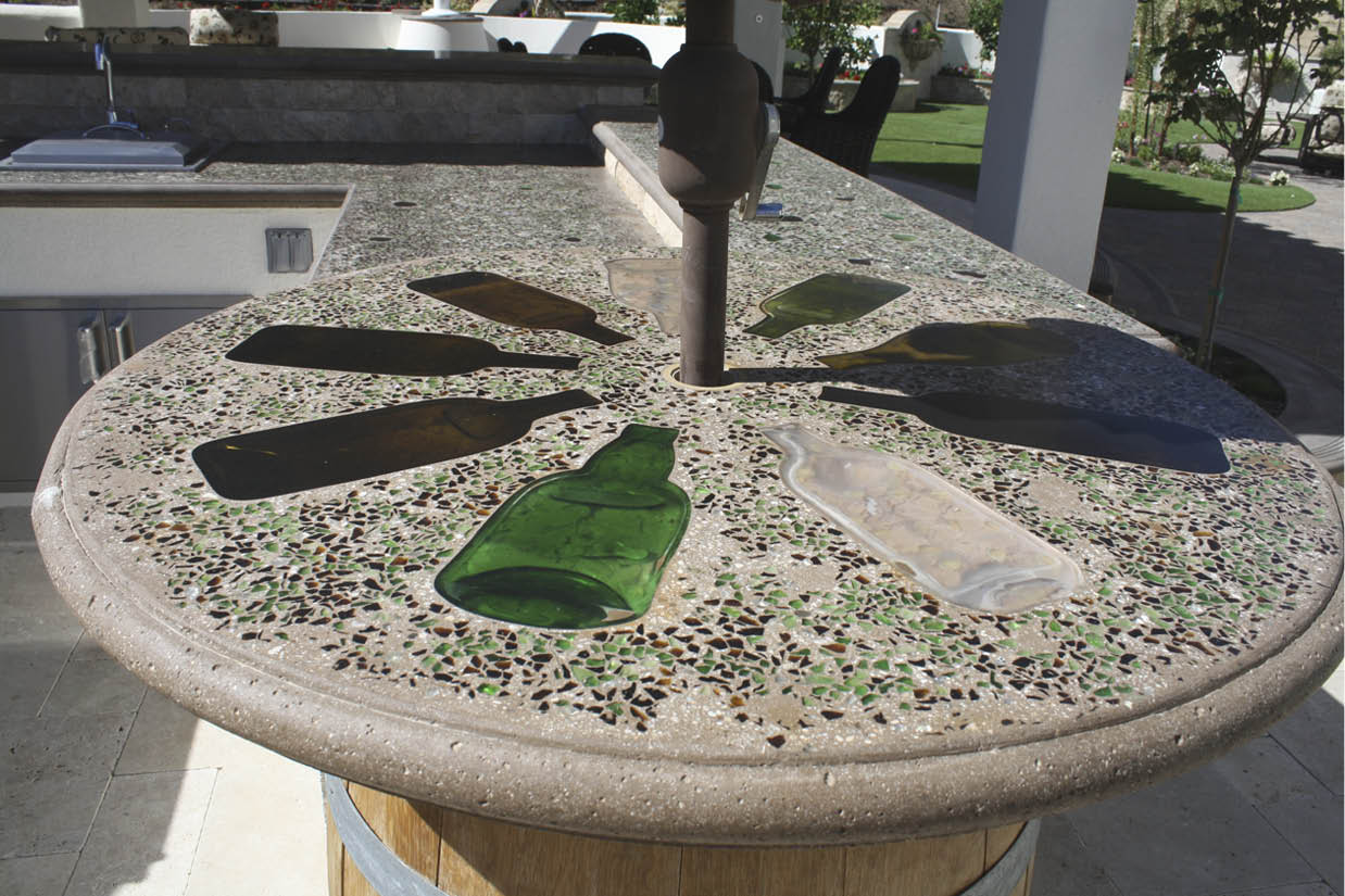 The crew tamps in the glass with a wood float and goes over them with a steel trowel. After that step, Cohen lets the concrete cure for a week or so before grinding, honing and polishing the top with three-head polished and diamond-tipped heads.