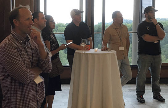 Group of people listening to a presentation at the DSSG summit in Chicago.