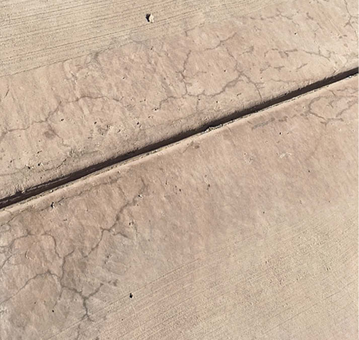 Spider-web cracking occurs when theres rapid moisture loss at the surface during the finishing stage. Using a proper finishing aid can greatly reduce these cracks.