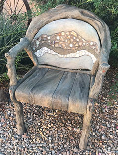 Chair made with concrete and carved to give it a custom look.