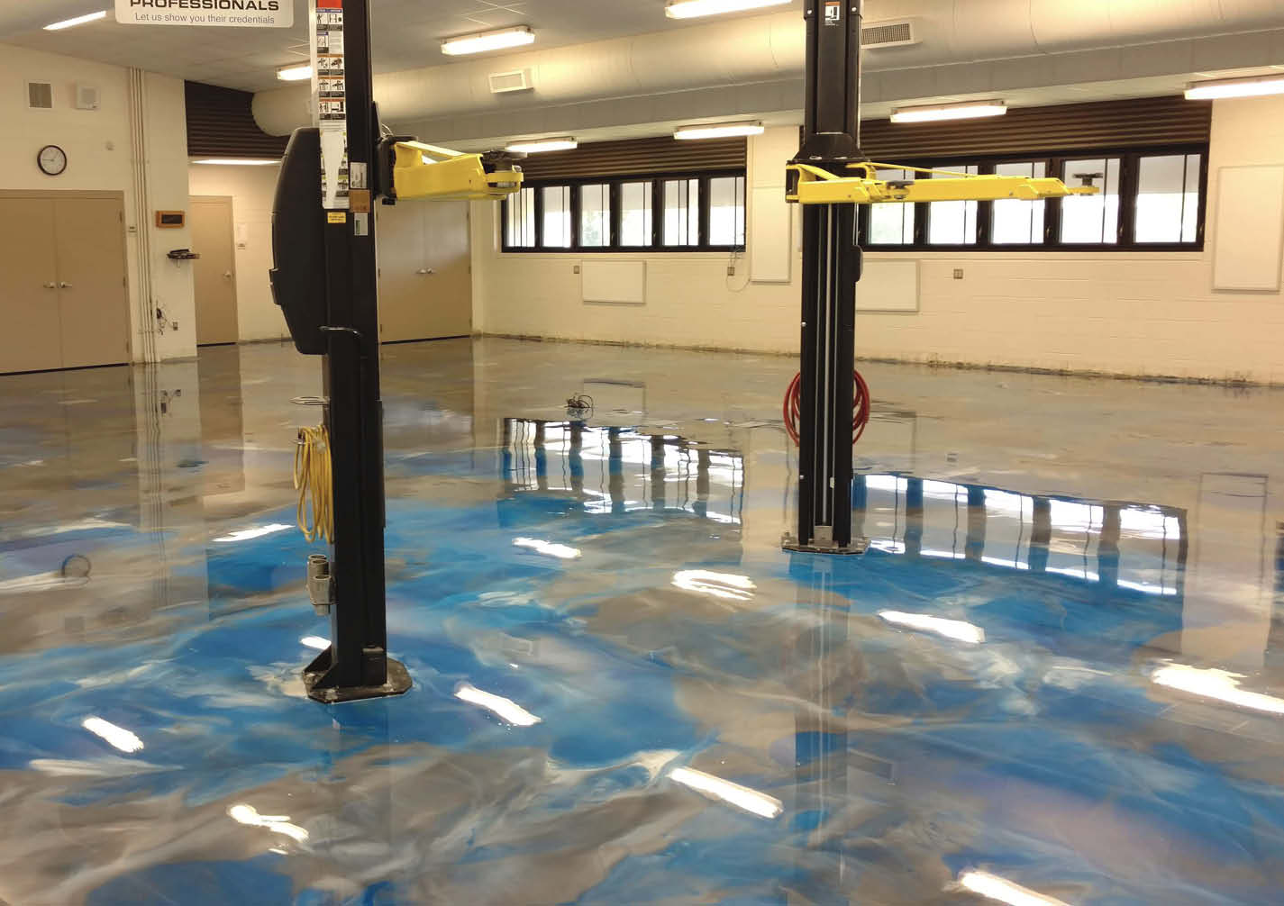Blue and gray metallic epoxy floor in garage.