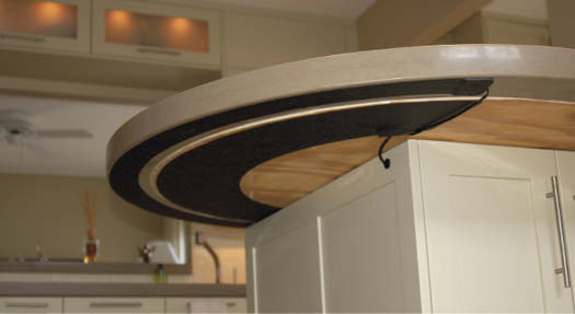 The heaters are sold in custom-designed configurations as well as in standard rectangular shapes. They are priced primarily on a square-foot basis and start as low as $250 for smaller standard heaters, including the thermal control unit. Here is the underside of a concrete countertop.