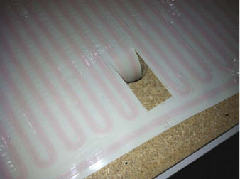 Placing the coils in the concrete countertops.