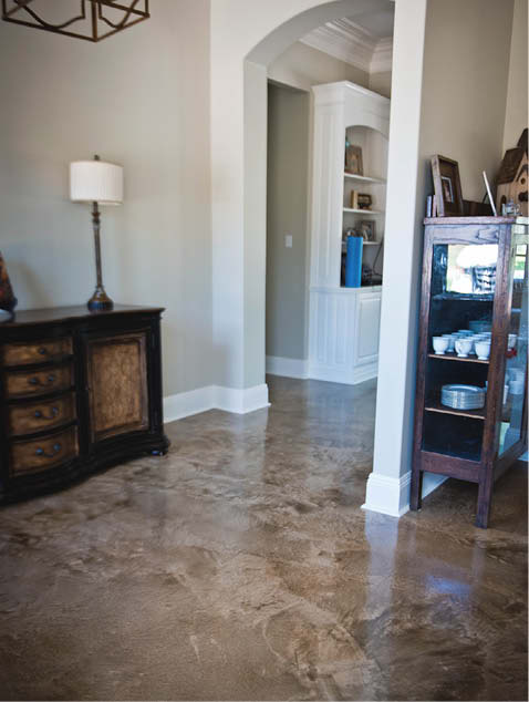 Concrete floor in a hallway space in brown hues.