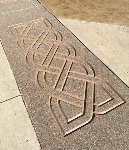 stenciled concrete design in a celtic knot pattern