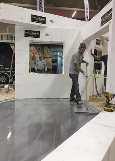 Dale Coughlin applies metallic epoxy