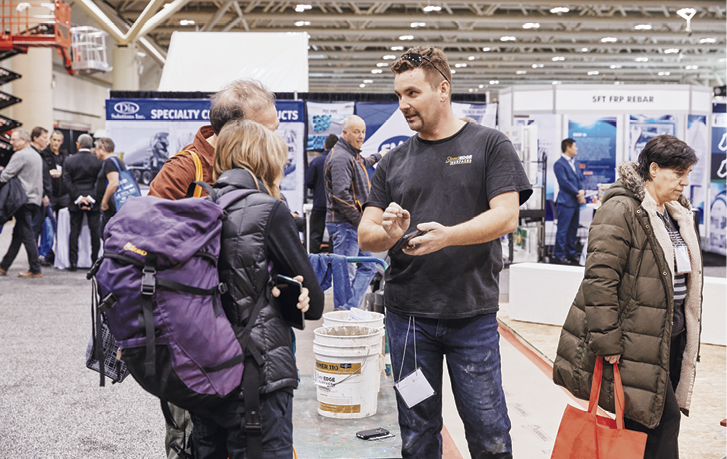 Attendees exchanging ideas with a manufacturer rep at Concrete Decor LIVE!