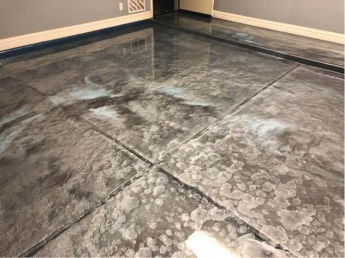 Jon Kopps garage at his house displays his metallic flooring handiwork in a combination of Blue Ice, Sterling and Quick Silver.