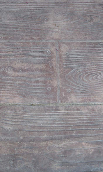Repairing the damage involved stripping and refinishing with a translucent concrete stain.