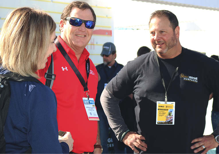 Gregg Hensley speaks with attendees.