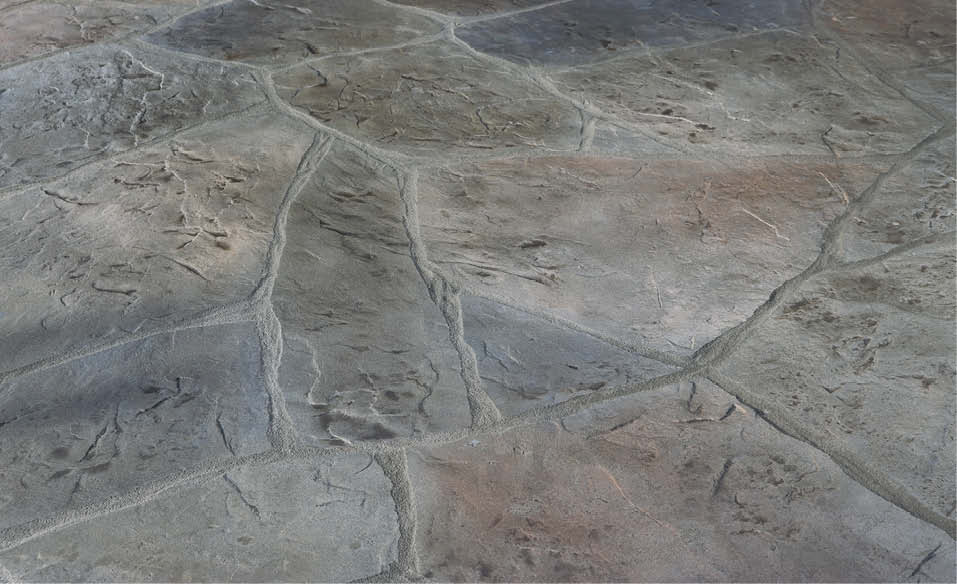 Concrete overlay by Stone Edge Surfaces to create a cobblestone look.