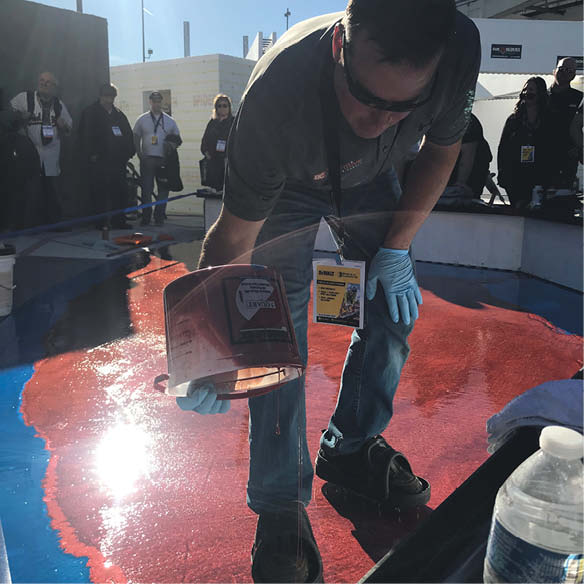 Jeff of BC Decorative Concrete places Laticrete polyaspartic. 