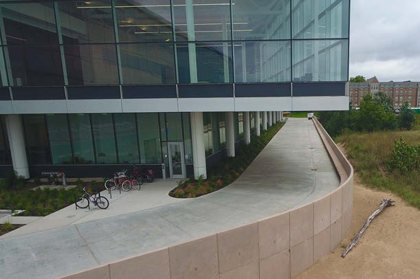 Some of the walls distinct features are the curvature in multiple planes and the skate-deterrent void, which was created to prevent individuals from damaging the bench sections.