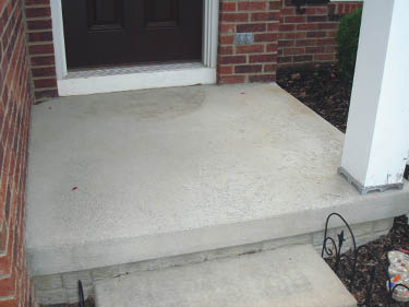 A plain concrete step without any upgraded features.