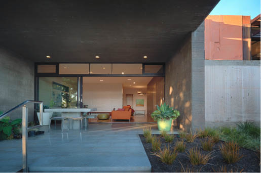 The textured concrete exterior walls have resonance throughout the house interior with our proprietary, ultra-smooth, crafted concrete countertops, vanities, sinks and wall surfaces.