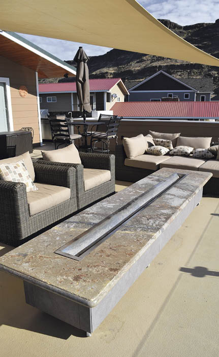 Christina Arnall calls herself concrete obsessed but the more things shes learned to do, the more her business has expanded. In this case, a custom-made gas firepit helps set this patio apart from the neighbors.