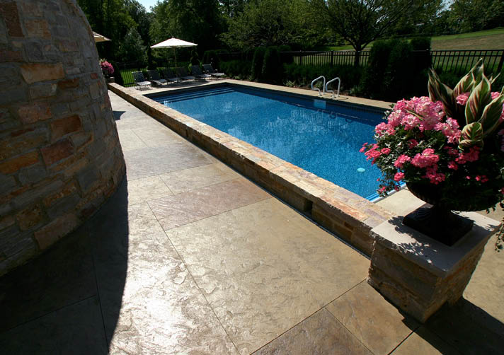 Waiting 28 days before applying coatings such as sealers and stains on concrete is a standard practice among concrete contractors. The real reason for the wait time has more to do with ensuring the concrete is dry rather than strong enough to be finished.