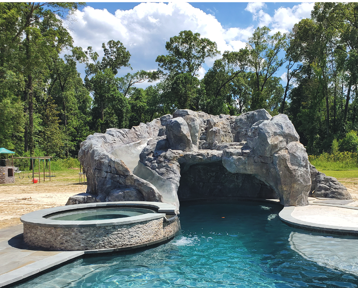 Concrete rock feature with a built in water slide
