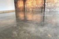 Two coats of sealer leaves this concrete shiny but will show imperfections similar to the look you get when acid staining.