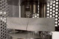 Concrete with a break in the middle to indicate flexural break