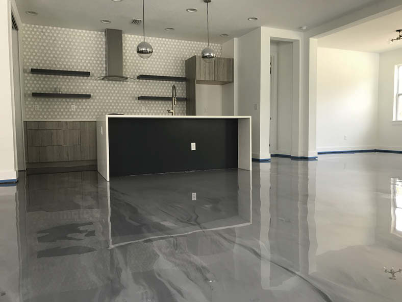 A comfortable kitchen with gray epoxy floor accented with white.