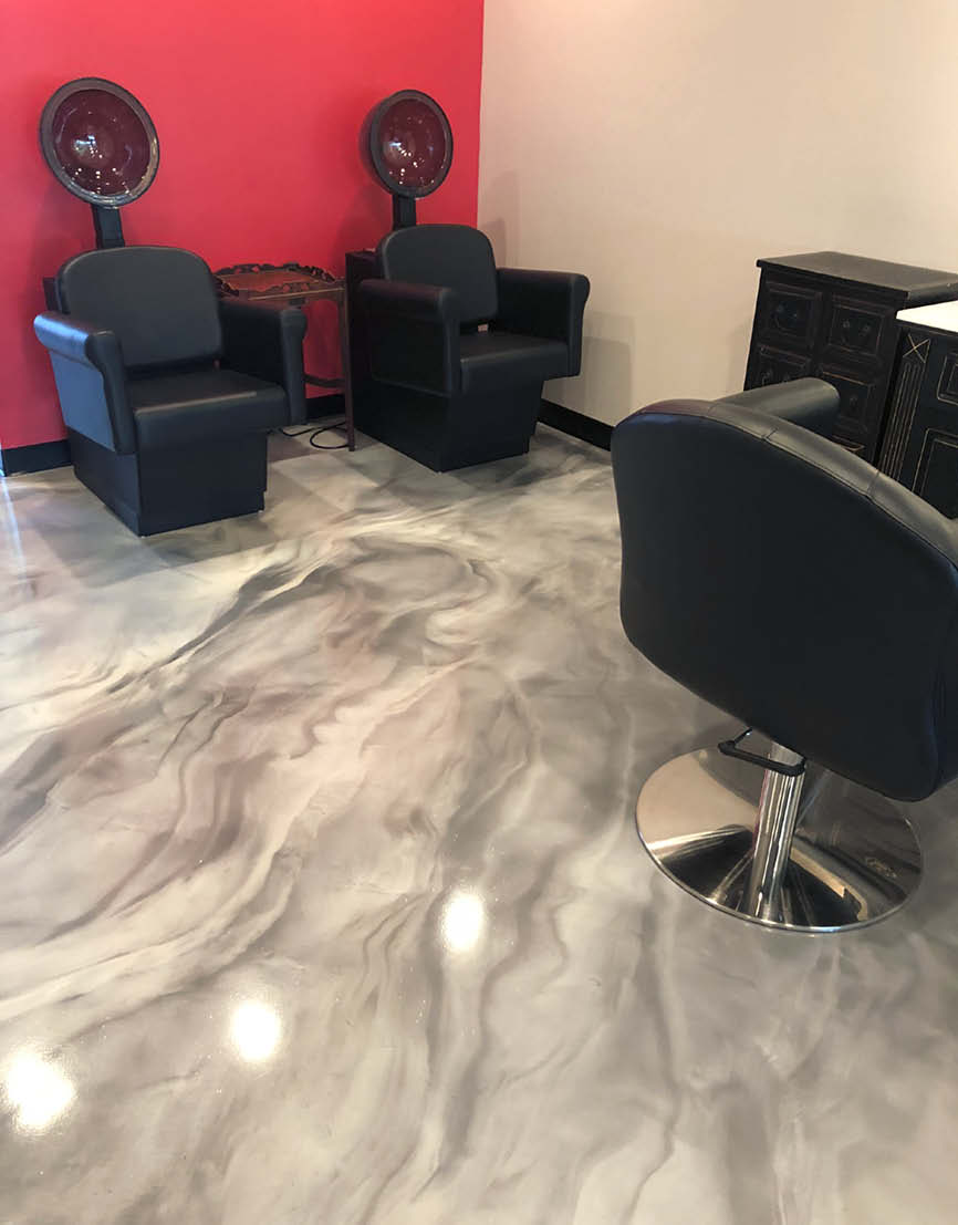 A salon gets a decorative concrete makeover with a new gray and white epoxy floor.