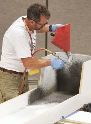Jake Brady casting a concrete bench at the Concrete Decor Show.