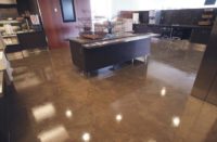 Stained concrete floor with a desk in the middle