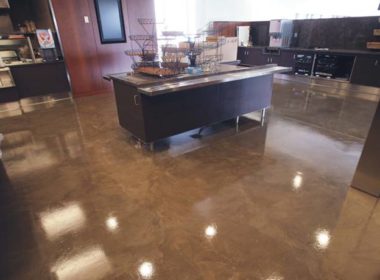 Stained concrete floor with a desk in the middle
