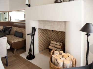 A concrete fireplace with clean, geometric lines that give the space a modern feel.