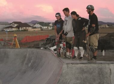 Michael Dahl and others from Airspeed Skateparks watching a skater doing tricks.