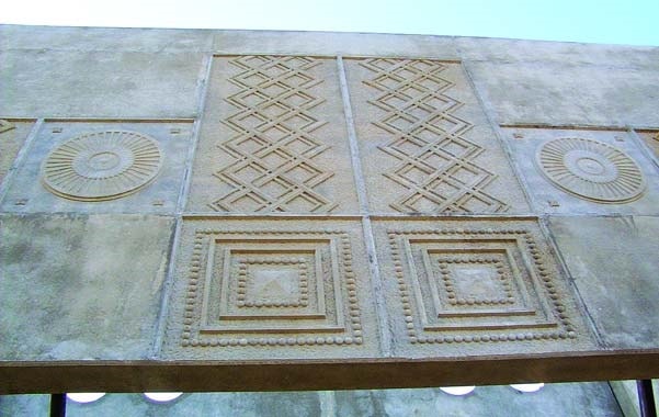 Inca design imprinted into a concrete wall during placement using concrete formliners.