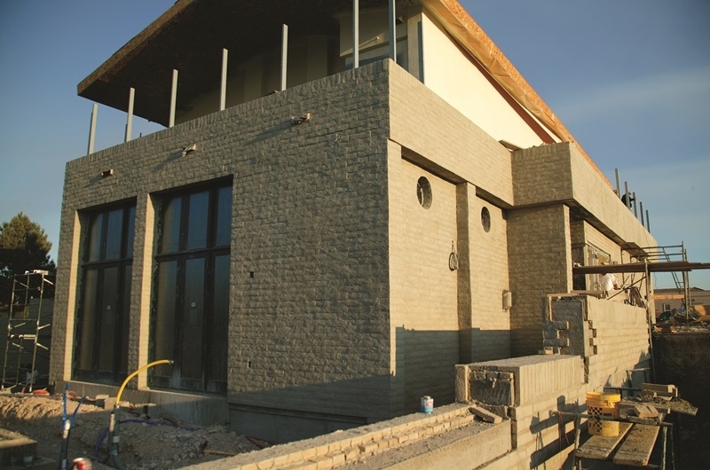 TNAHs exterior finish features decorative concrete masonry and stucco.