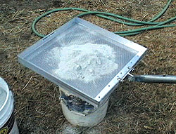 Color Spreader - Color hardener is dumped into the Spreader while its held over a bucket, then carried to the slab. When the tray is gently shaken back and forth over the concrete, the powder cascades downward in even strokes, laying a path 14 inches wide.
