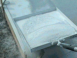 On the first pass, hand-scattering will cover only 30 percent to 40 percent of the slab, Bettencourt says, while one pass with the Spreader will cover 85 percent to 95 percent. The tool also doesnt leave too much in spots, potentially saving the contractor a lot of powder. Thats just a bonus at the end of the job, to be saving in product, Bettencourt says.