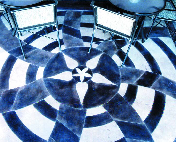 Concretizen Floor - This effect was achieved by using three layers of black stain: first,a solid black; then a 50 percent solution; and third, a 10 percent wash over the whole floor. The solid black was stippled on to create texture.
