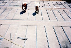 Concrete Countertops production - Up to 20 people at once worked assembly-line style on the project, with each person doing a specific task on several slabs all day long.