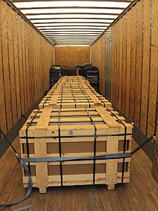 shipping container with hundreds of concrete countertops for side tables - The tops were shipped in crates that weighed 3,000 pounds when full. 