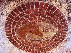 Logos are popular designs for stenciling projects, like this one created by Decorative Concrete Impressions.