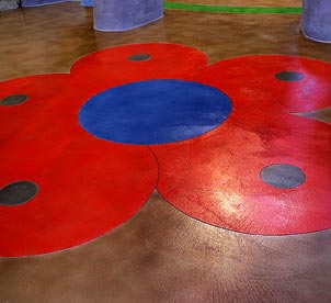 The stencils Wardall had made were large enough that he didnt have to peel and stick them to the floor, giving him flexibility to move them around and make adjustments. He then traced the pattern with chalk, used a 4-inch grinder to make his saw cuts, and "from there it became a large paint-by-numbers."