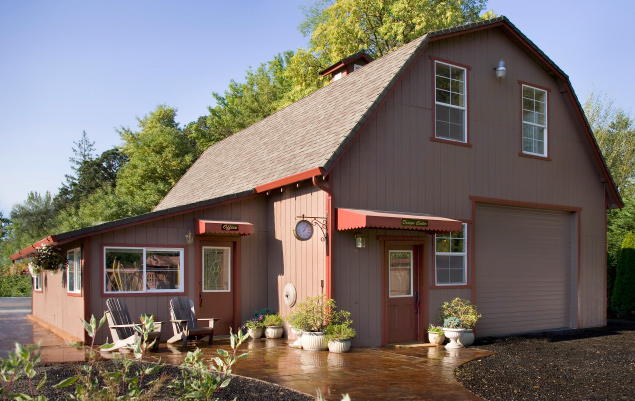 Barn style shop with decorative concrete walk.