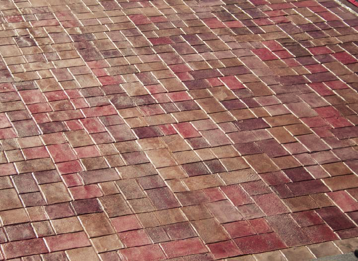 With the help of SureCrete Design Products and Art Stamped Concrete, contractor Craig Heidinger was able to match a stamped overlay to an existing paver pattern used throughout the resort.