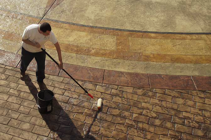 An employee for Designs in Concrete seals a project at the Orsini complex, a series of three new high-end luxury condominiums in downtown Los Angeles.