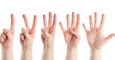 Five hands holding up one two three four five fingers
