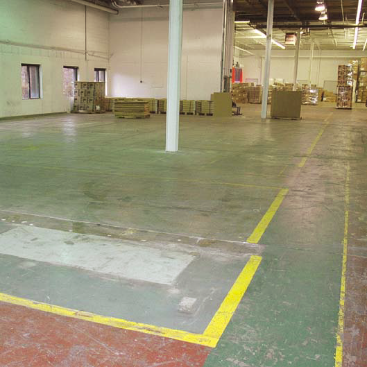 The epoxy on this lighting factory floor was removed using a scarifier.