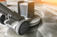 a grinder going through the concrete polishing process
