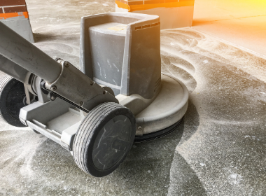 a grinder going through the concrete polishing process