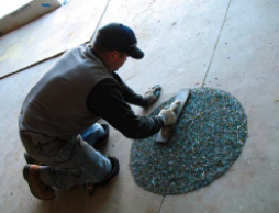 Block-outs in this market floor were seeded with transparent, round and polished jelly bean glass and exposed through washing to maintain aggregate clarity and a river-pebble pro?le.